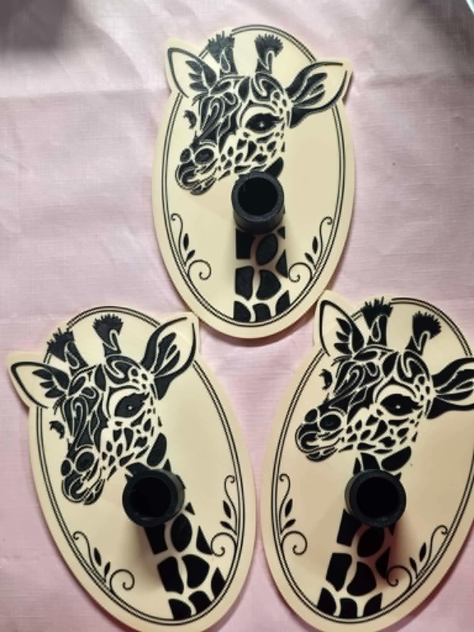 Three custom Melissa QCB tumbler drying bases with black giraffe artwork